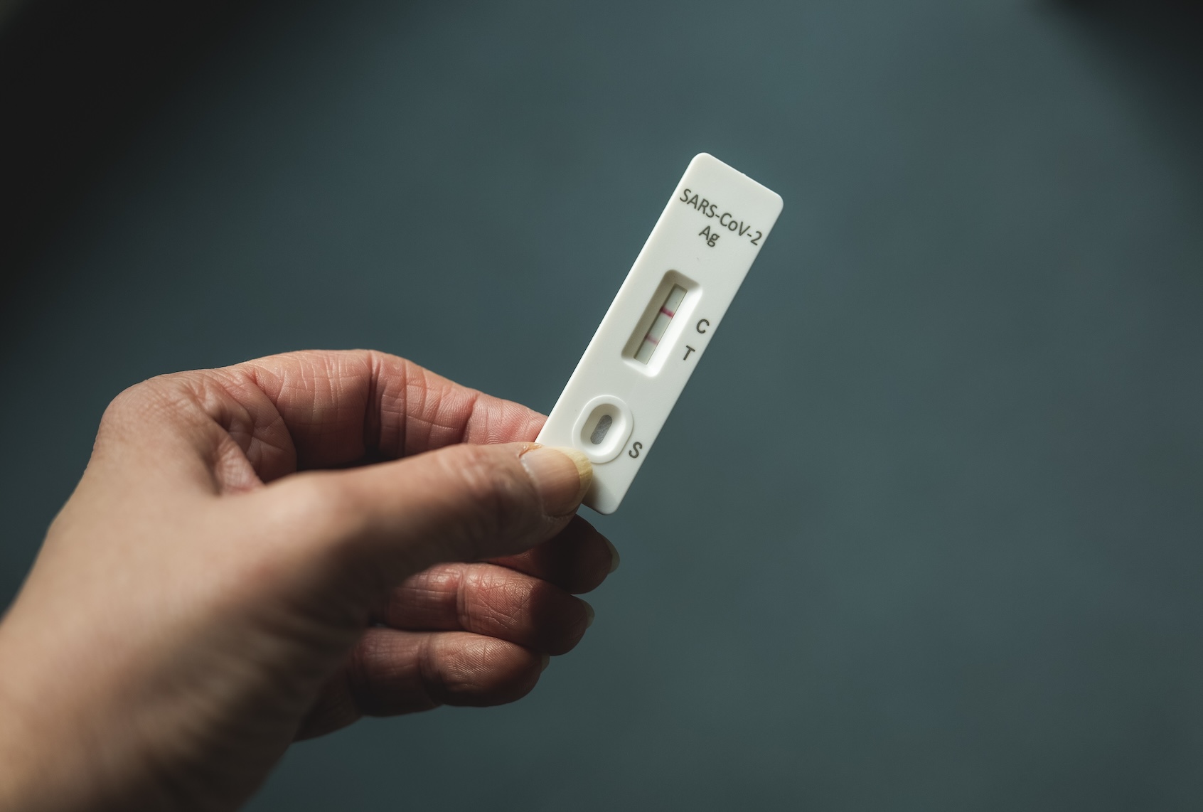 Hand of woman holding rapid diagnostic test for COVID-19. (Getty Images / Westend61)