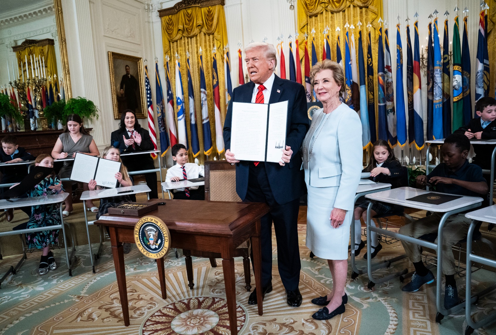 President Donald Trump poses with Secretary of Education Linda McMahon after signing an executive order aimed at closing the Education Department at the White House on Thursday, March 20, 2025 in Washington, DC. (Jabin Botsford/The Washington Post via Getty Images)