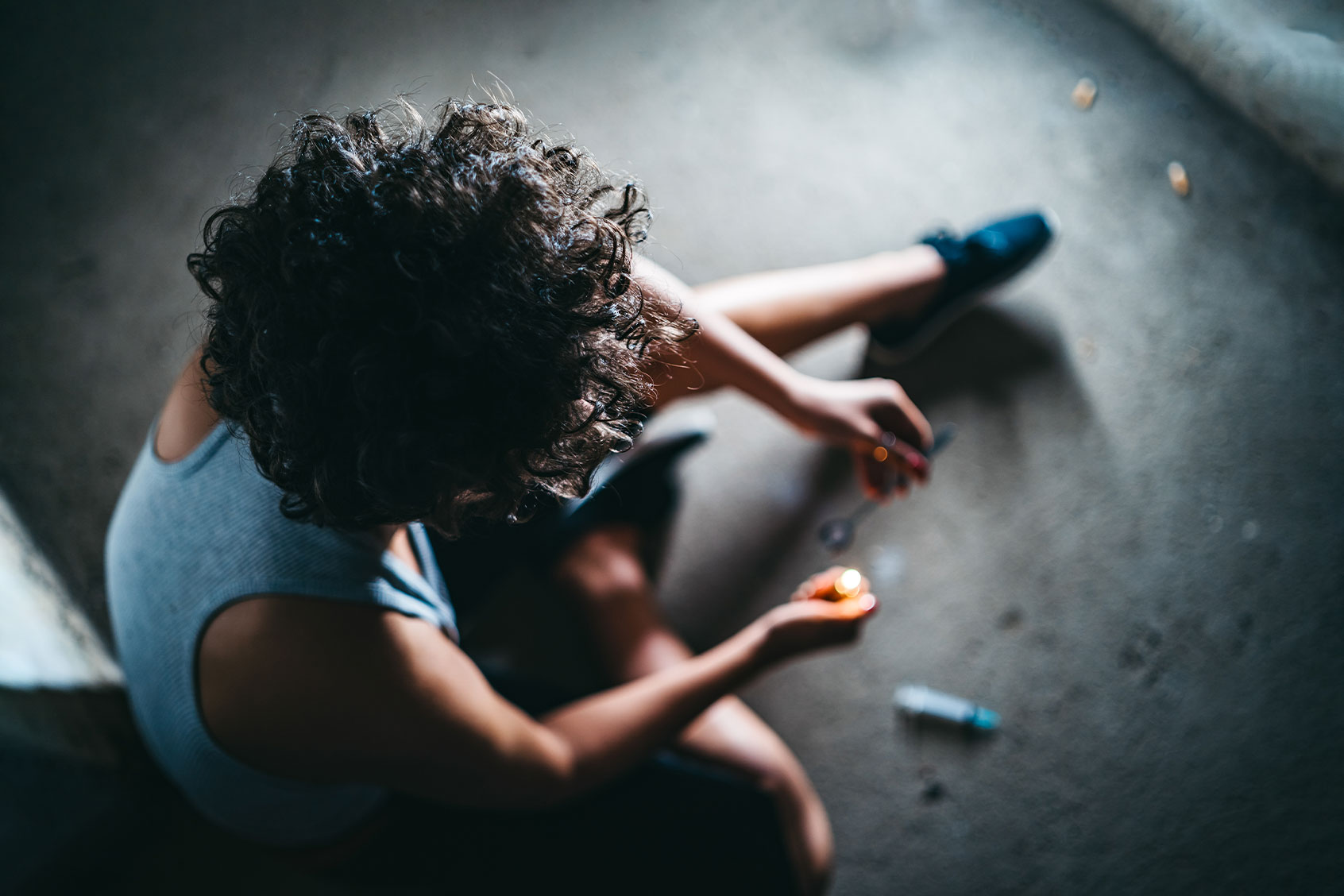 Young caucasian female addict preparing heroin dose. (Getty Images/urbazon)
