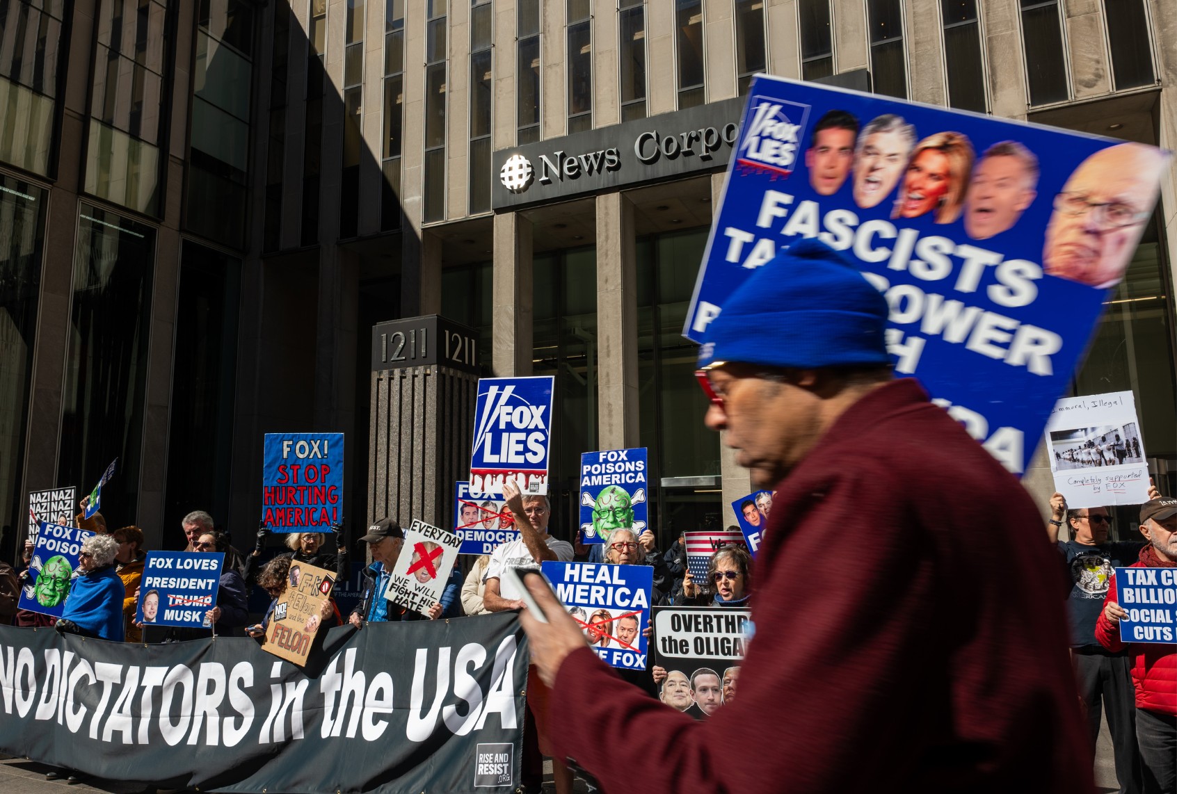 A group of protestors who gather weekly, demonstrate outside News Corporation headquarters, the parent company of Fox News, in midtown Manhattan on March 18, 2025 in New York City. (Spencer Platt/Getty Images)