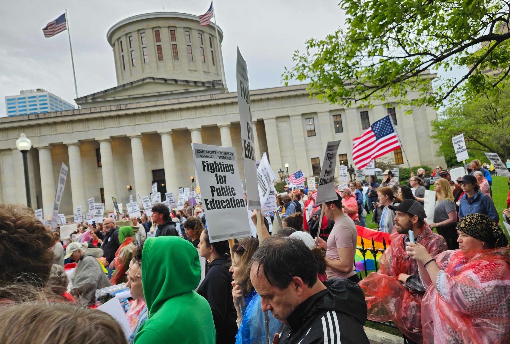 Protesters gather around the William McKinley Monument at the Ohio Capitol building on May 1 during a May Day action focused on public education. (Tatyana Tandanpolie)