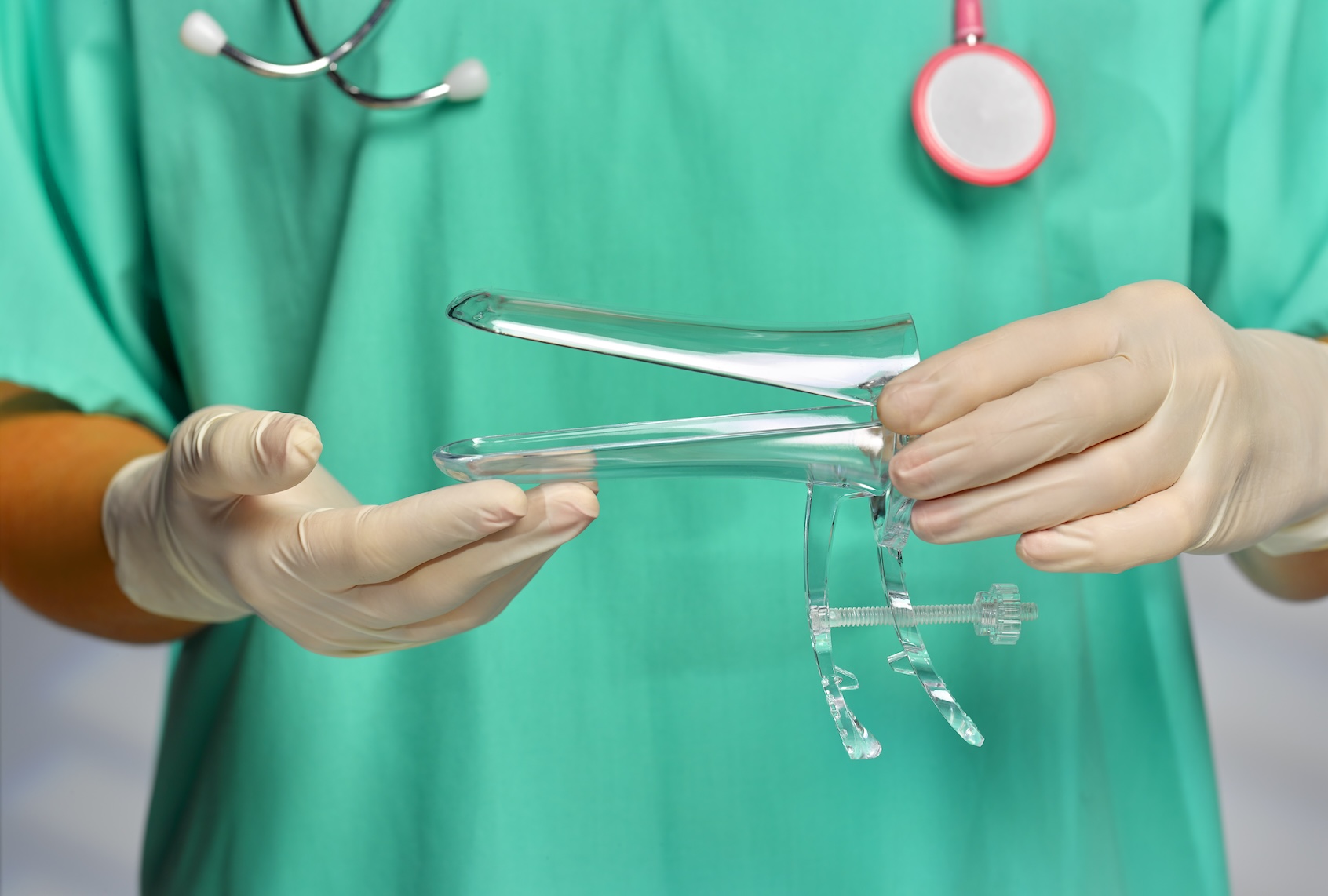 Gynecologist holding vaginal speculum. (Getty Images / Peter Dazeley)