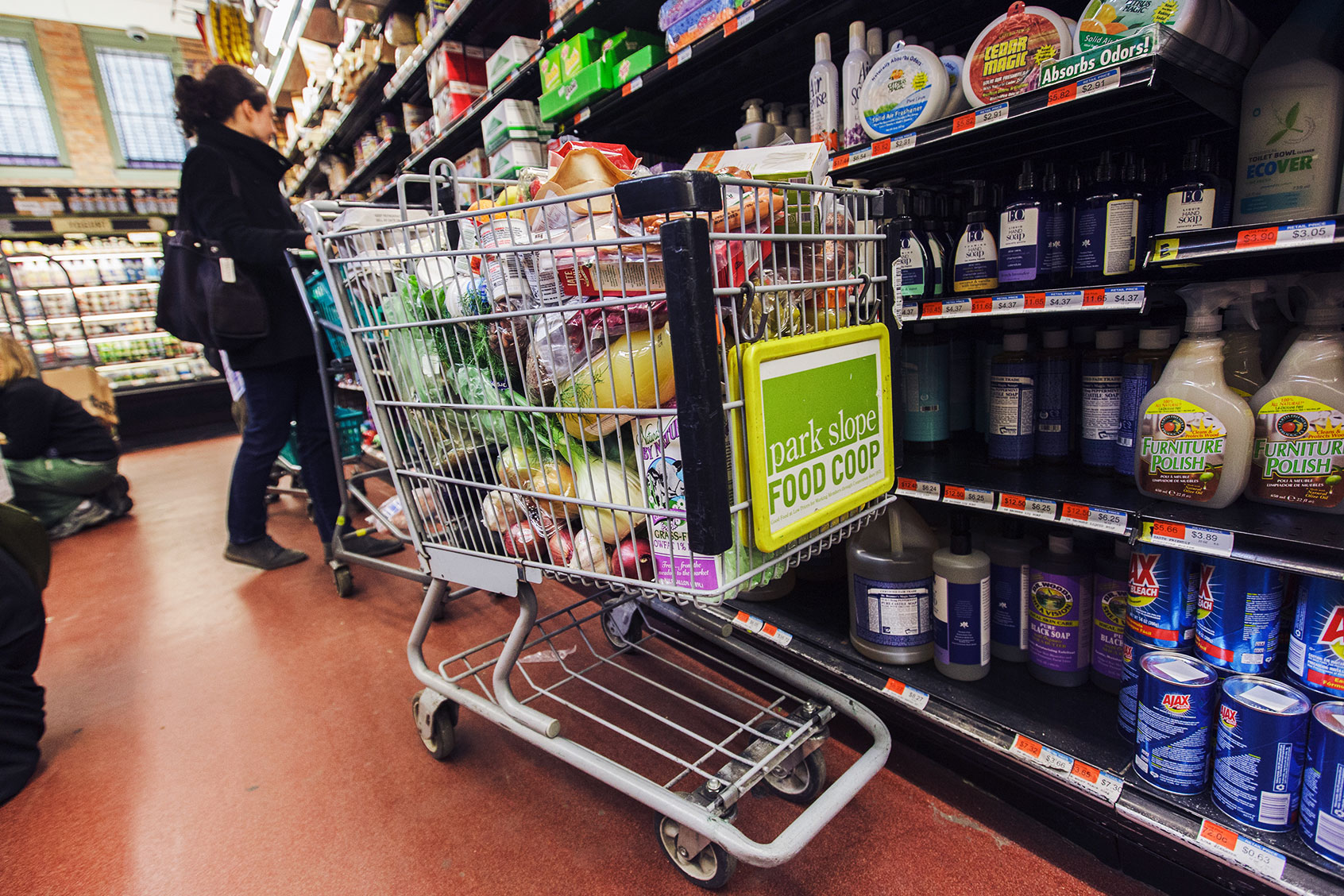Members shop at the Park Slope Food Coop in Brooklyn. Formed in 1973, the Coop is one of the oldest and largest food cooperatives in America. PSFC has more than 15,500 members, most of whom work once every four weeks in exchange for a 20 – 40% savings on groceries. Only members may shop at the PSFC. (James Leynse/Corbis via Getty Images)