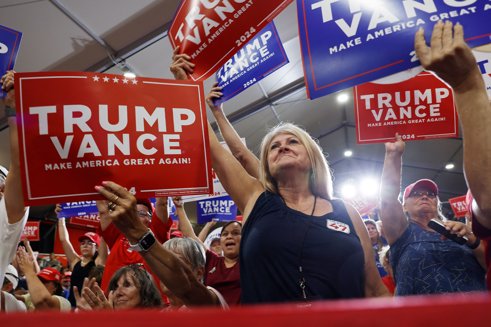 Supporters hold "Trump Vance" signs at Republican vice presidential nominee U.S. Sen. JD Vance (R-OH) campaign rally at Arizona Christian University on July 31, 2024 in Glendale, Arizona. (Anna Moneymaker/Getty Images)